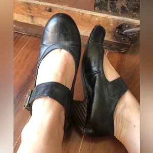 Mild heeled black Mary-Jane Shoes.